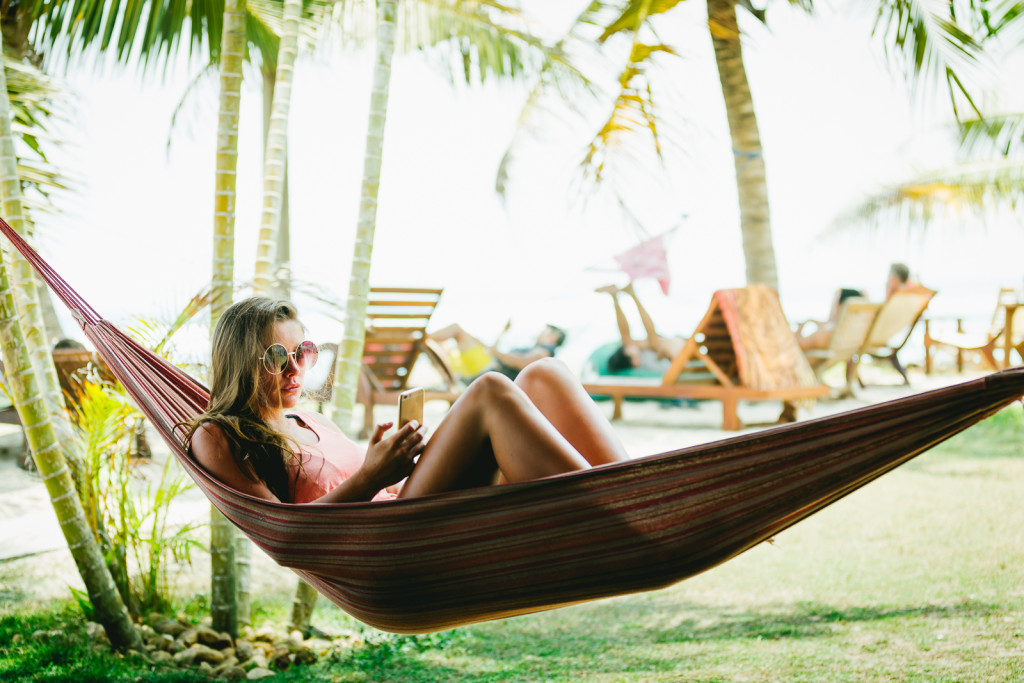 A chick enjoying an afternoon relaxing in a hammock after a surf